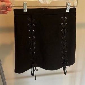 Black mini skirt, beautiful black ribbon lace up on front, size 2